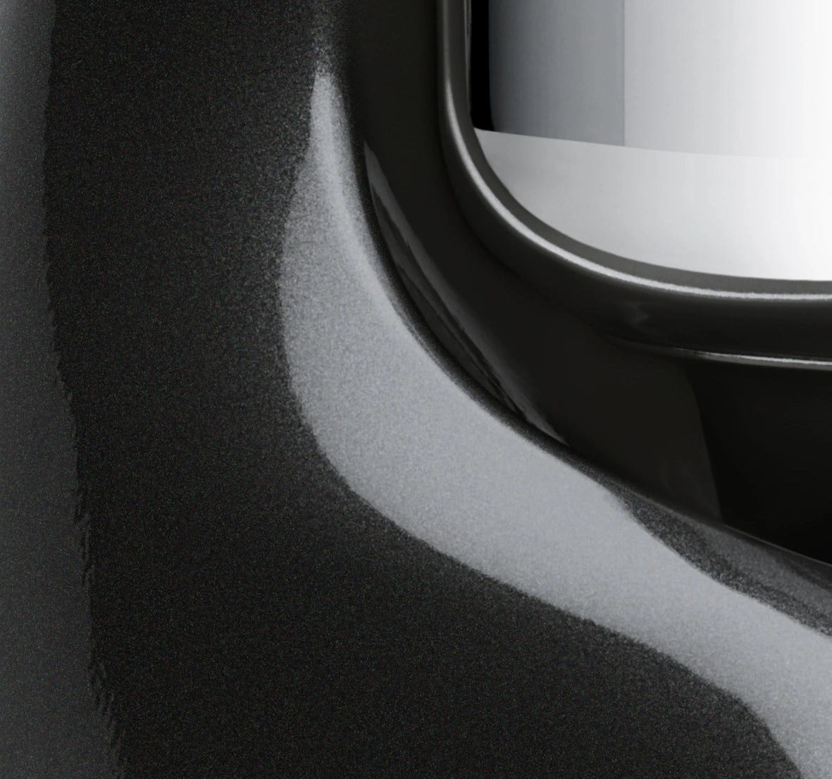 Close-up view of the Ankarsrum Assistent Original Stand Mixer in black-diamond (akm-6230-bd, gloss-finish), highlighting its premium build, powerful motor, and unique mixing bowl design for efficient dough kneading.