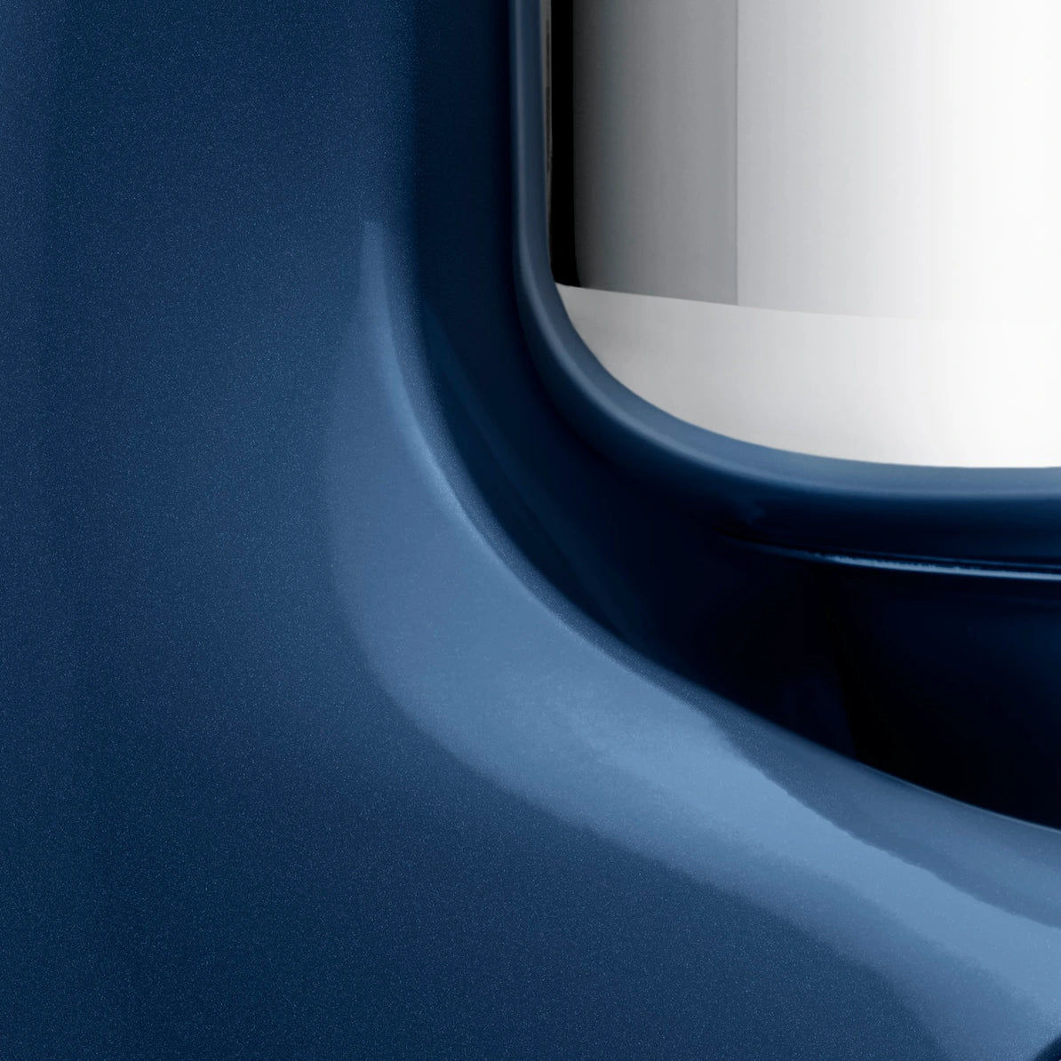 Close-up view of the Ankarsrum Assistent Original Stand Mixer in ocean-blue (akm-6230-ob, gloss-finish), highlighting its premium build, powerful motor, and unique mixing bowl design for efficient dough kneading.