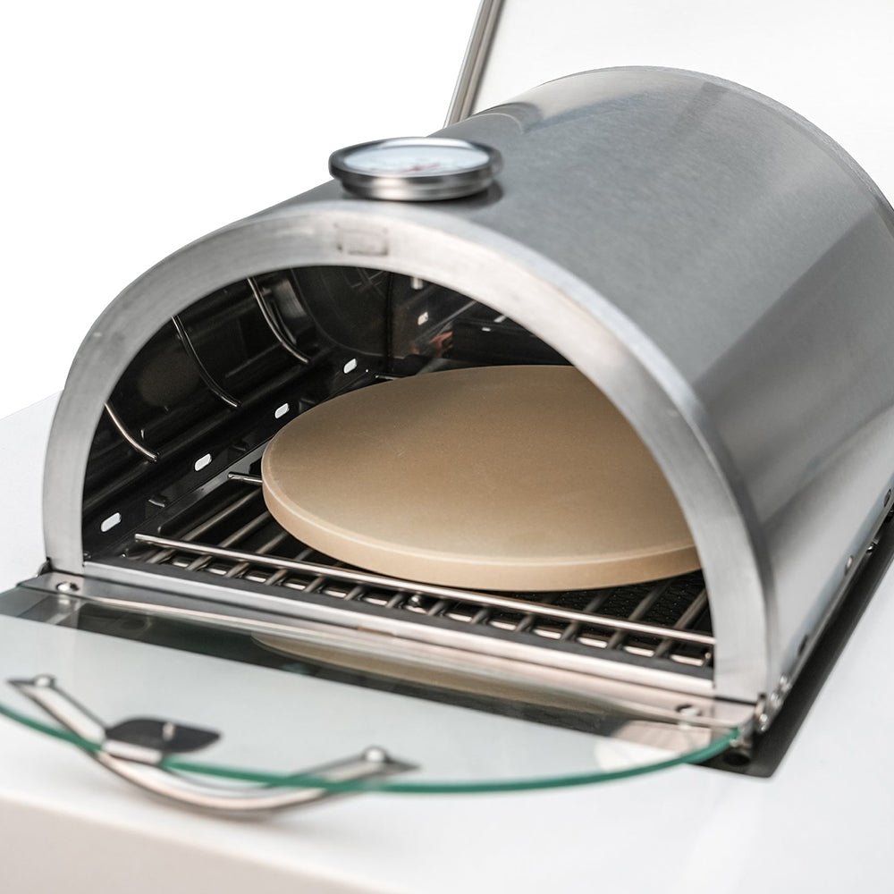 Close-up of the Mont Alpi Side Burner Pizza Oven (MASBP) with pizza stone in outdoor use, highlighting the quality and functionality of the setup.