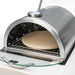 Close-up of the Mont Alpi Side Burner Pizza Oven (MASBP) with pizza stone in outdoor use, highlighting the quality and functionality of the setup.