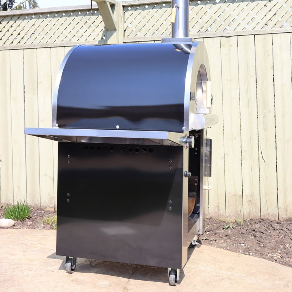 Close-up side view of the Pyro Kitchen Caldo V2 Hybrid Pizza Oven with stainless steel side shelf, designed for outdoor durability and functionality.