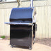 Close-up side view of the Pyro Kitchen Caldo V2 Hybrid Pizza Oven with stainless steel side shelf, designed for outdoor durability and functionality.