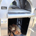 Close-up front view of the Pyro Kitchen Vera V2 Wood Fired Pizza Oven with logs stored neatly under the oven in the protected storage area.
