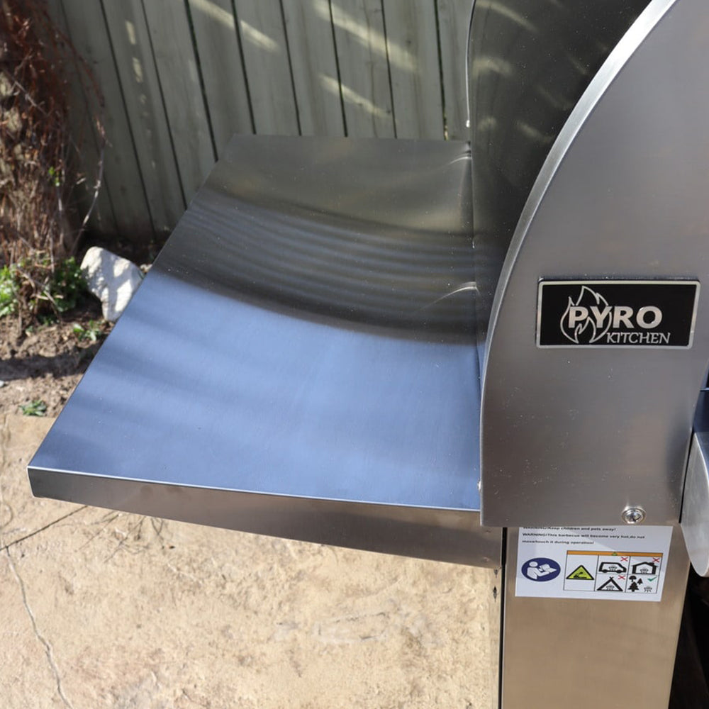 Close-up view of the Pyro Kitchen Vera V2 Wood Fired Pizza Oven showing the 14-inch stainless steel side shelf for added convenience.